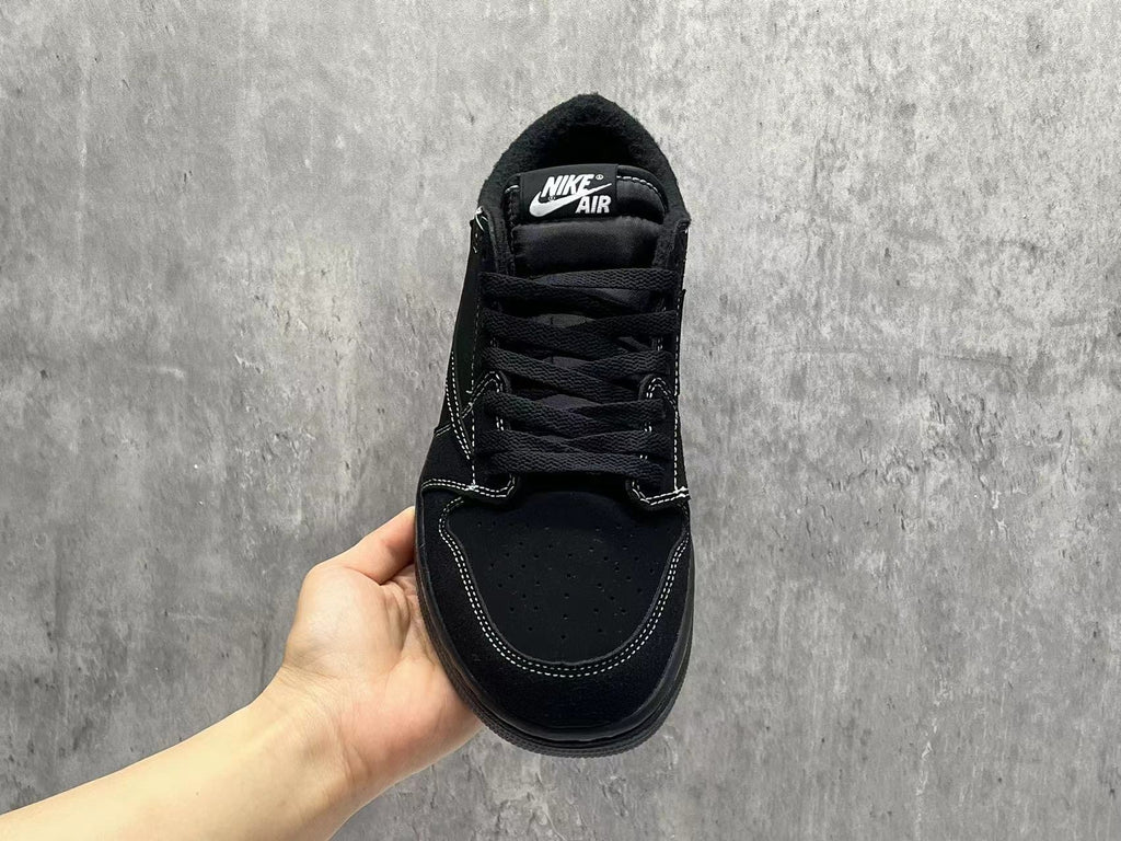 Air Jordan 1 Low Black Reverse Swoosh Sneakers | White Stitching