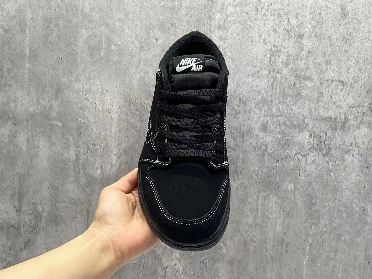 Air Jordan 1 Low Black Reverse Swoosh Sneakers | White Stitching