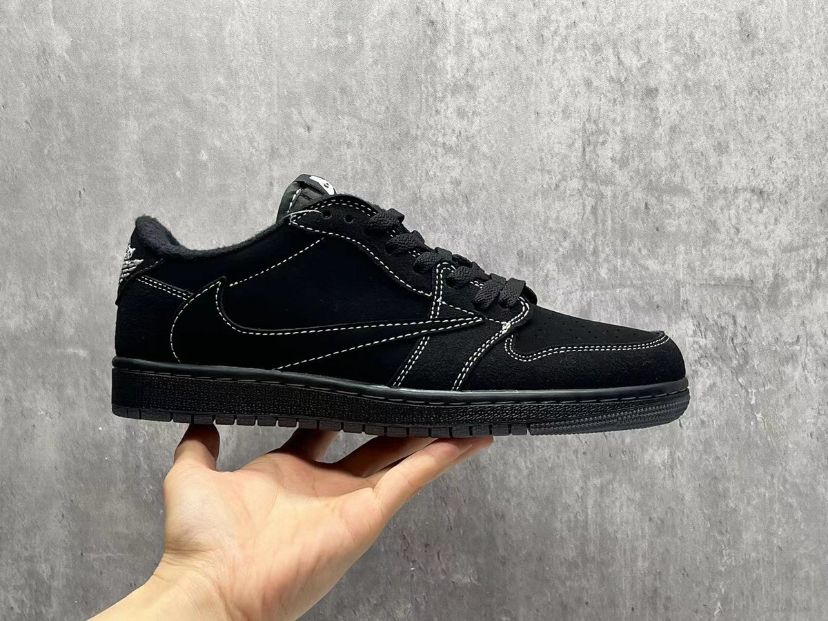 Air Jordan 1 Low Black Reverse Swoosh Sneakers | White Stitching