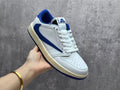 Air Jordan 1 Low White & Blue Reverse Swoosh Sneakers