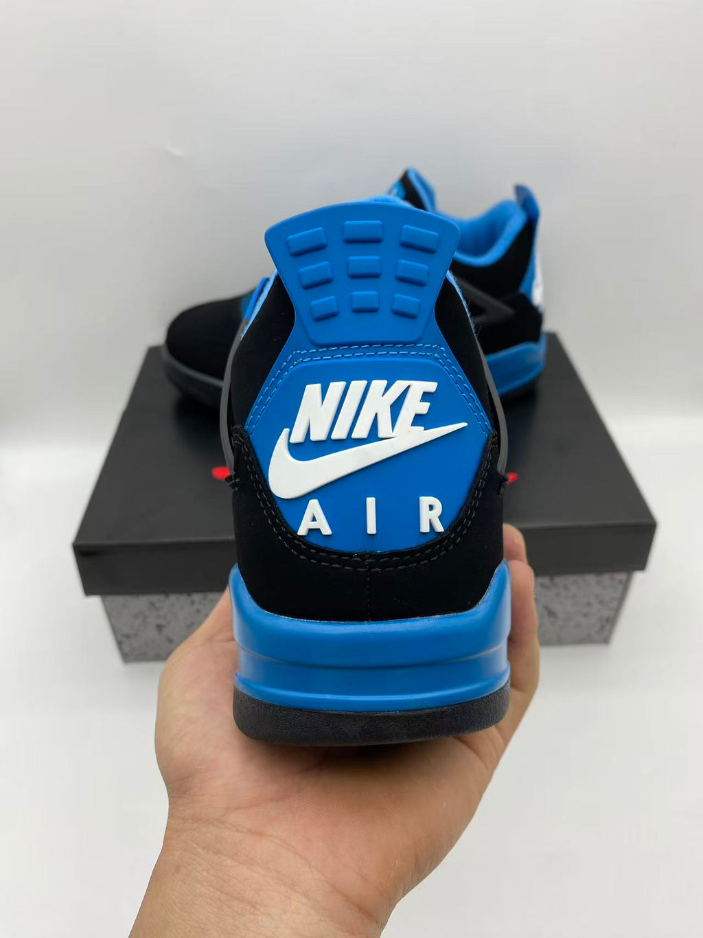 Air Jordan 4 Black & Blue Sneakers