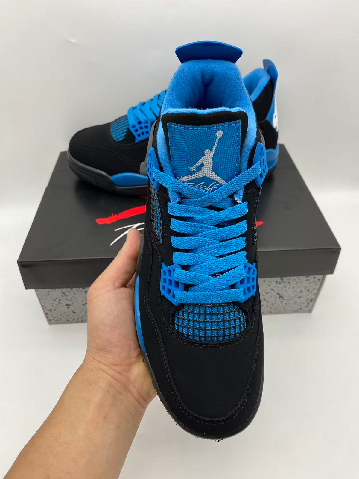 Air Jordan 4 Black & Blue Sneakers