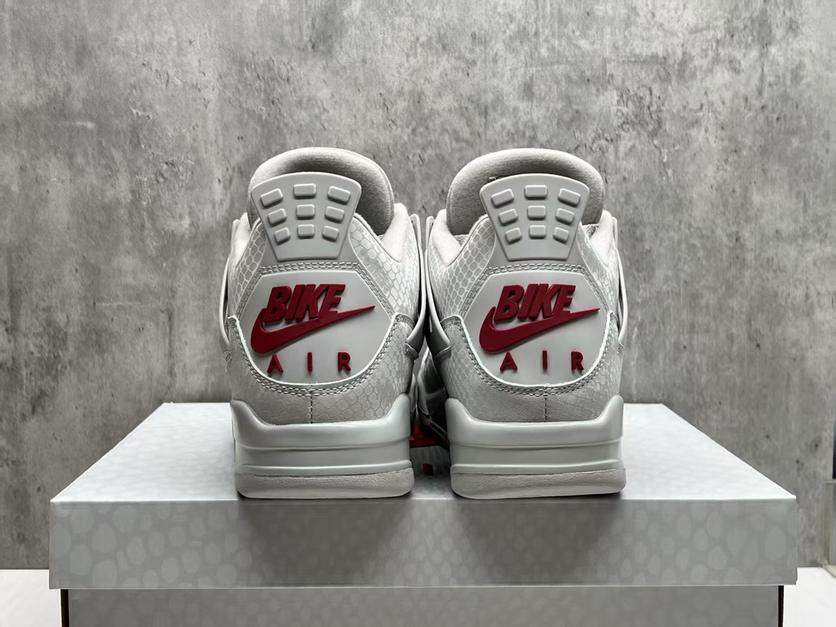 Air Jordan 4 Grey Sneakers with Red Accents