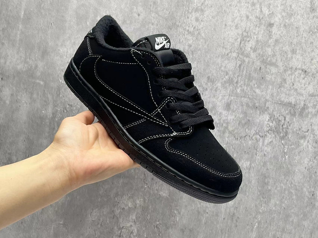 Air Jordan 1 Low Black Reverse Swoosh Sneakers | White Stitching